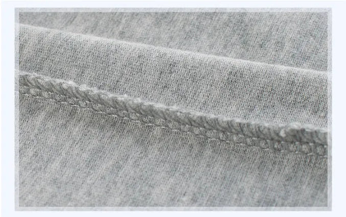 Grey cotton children's t-shirt laid flat, showing Asian size tags for 90cm, 100cm, 110cm, 120cm, 130cm, and 140cm lengths.