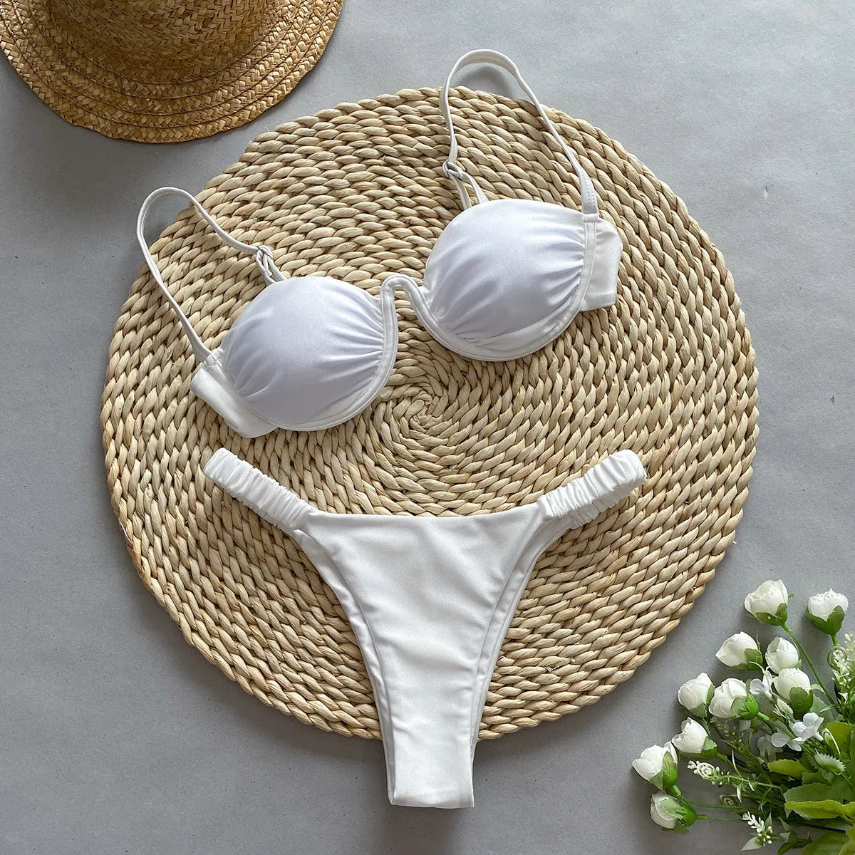 Women's black underwire bikini swimsuit set on a model, showing brief-style fit.