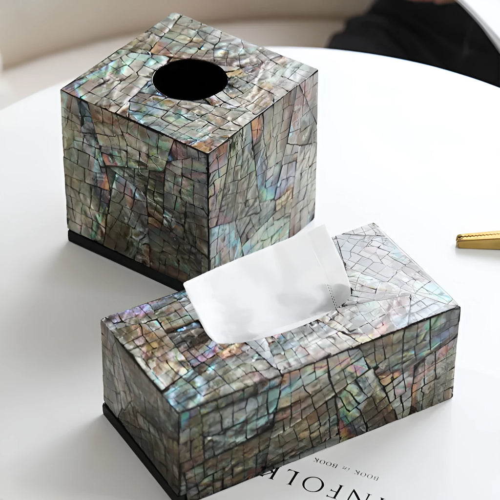 Black natural shell tissue storage box in rectangular and square shape options on a coffee table.