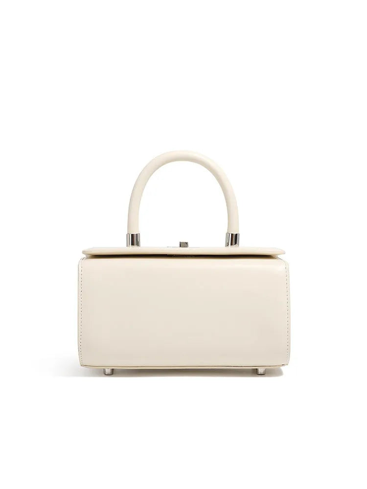 Women's leather crossbody bag in clamshell design with internal phone and document organisers