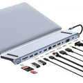 Silver 7-in-1 USB-C expansion dock with HDMI, VGA, USB ports, and a short 15cm connecting cable.