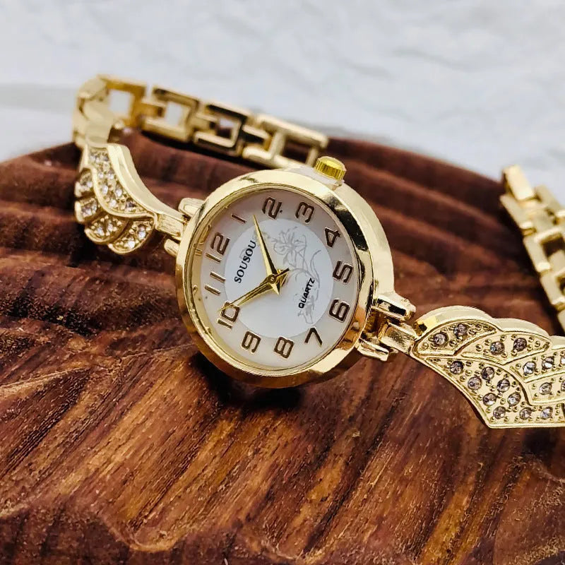 Women's stainless steel watch with round dial and 9mm thickness showing gold face option