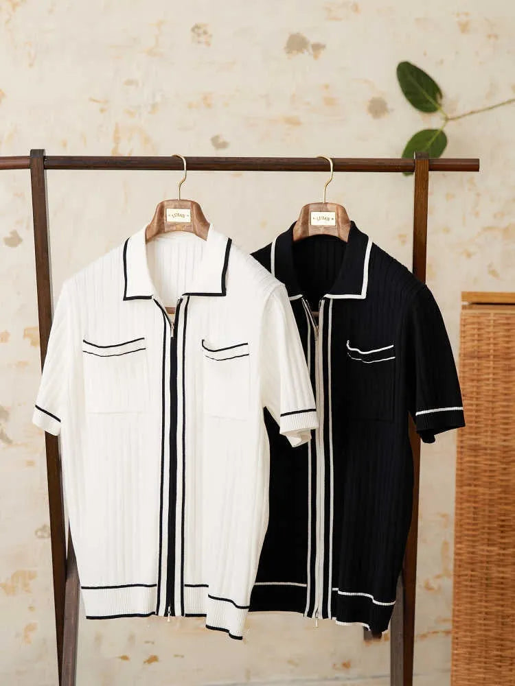 Slim black elastic knit polo shirt with a lapel collar and short sleeves on a hanger.