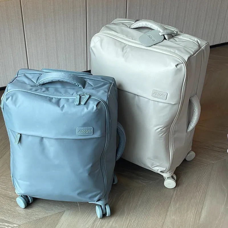 Ultra-light waterproof Oxford cloth suitcase in bluestone green with universal wheels, shown in 20-inch size