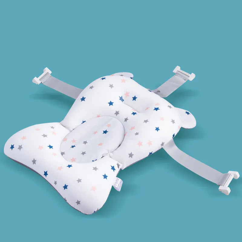 Foldable baby bath support mat with styrofoam cushion in white star pattern, placed in a bathtub