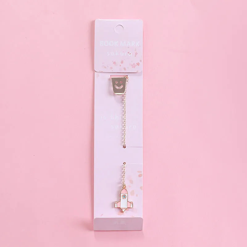 Alloy metal bookmark with cartoon pendant designs including panda, rocket and unicorn variations