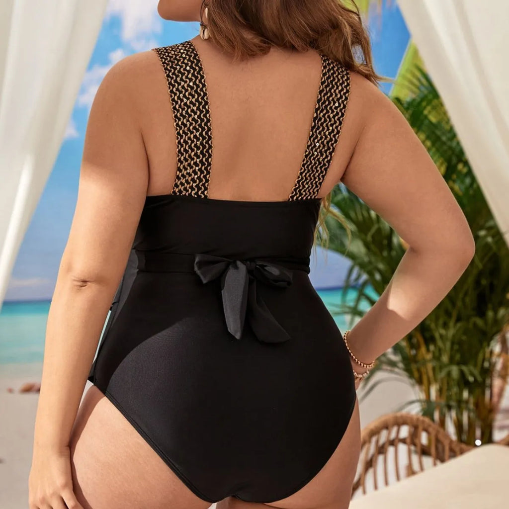 Women's black one-piece sleeveless swimsuit with a chest pad on a mannequin.