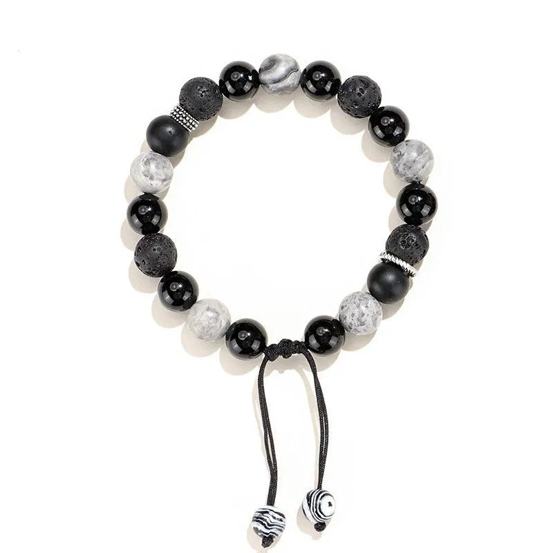Black agate map stone and volcanic rock bracelet with diamond clasp in 8mm and 10mm sizes.