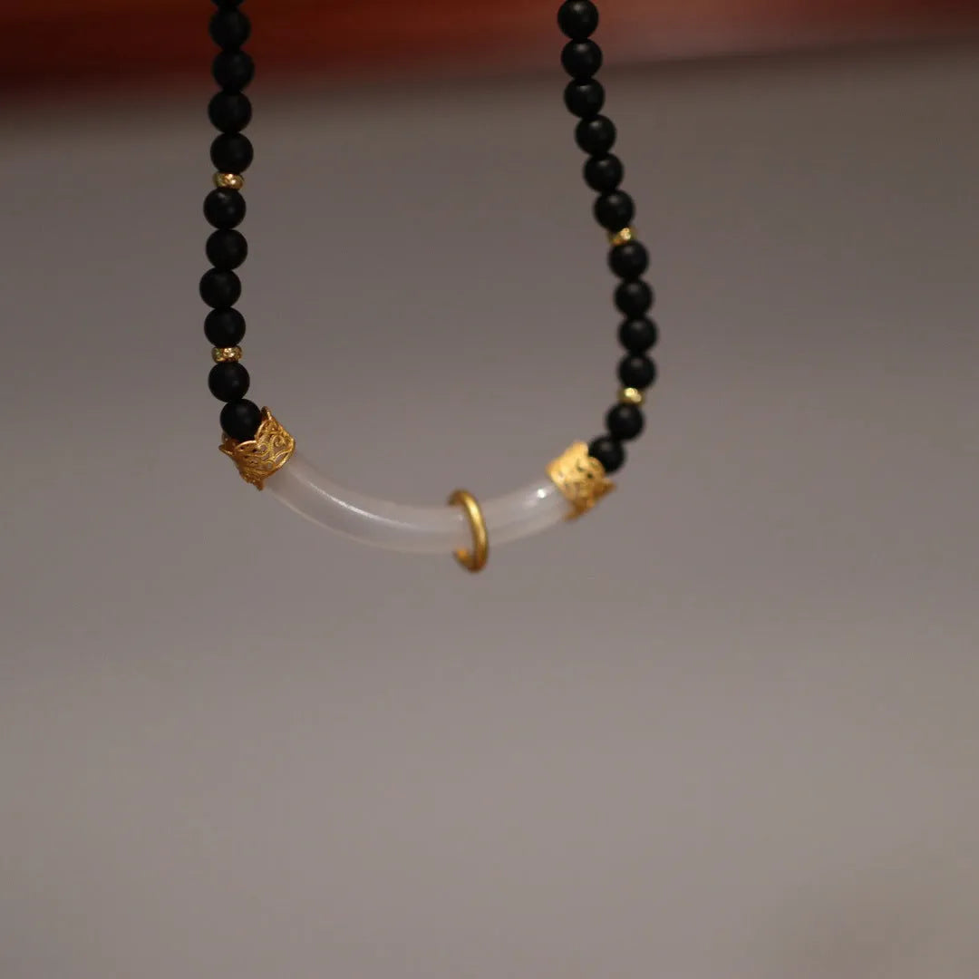U-shaped Chinese style necklace with frosted black agate, white chalcedony, and 925 silver plating on a ball bead chain.