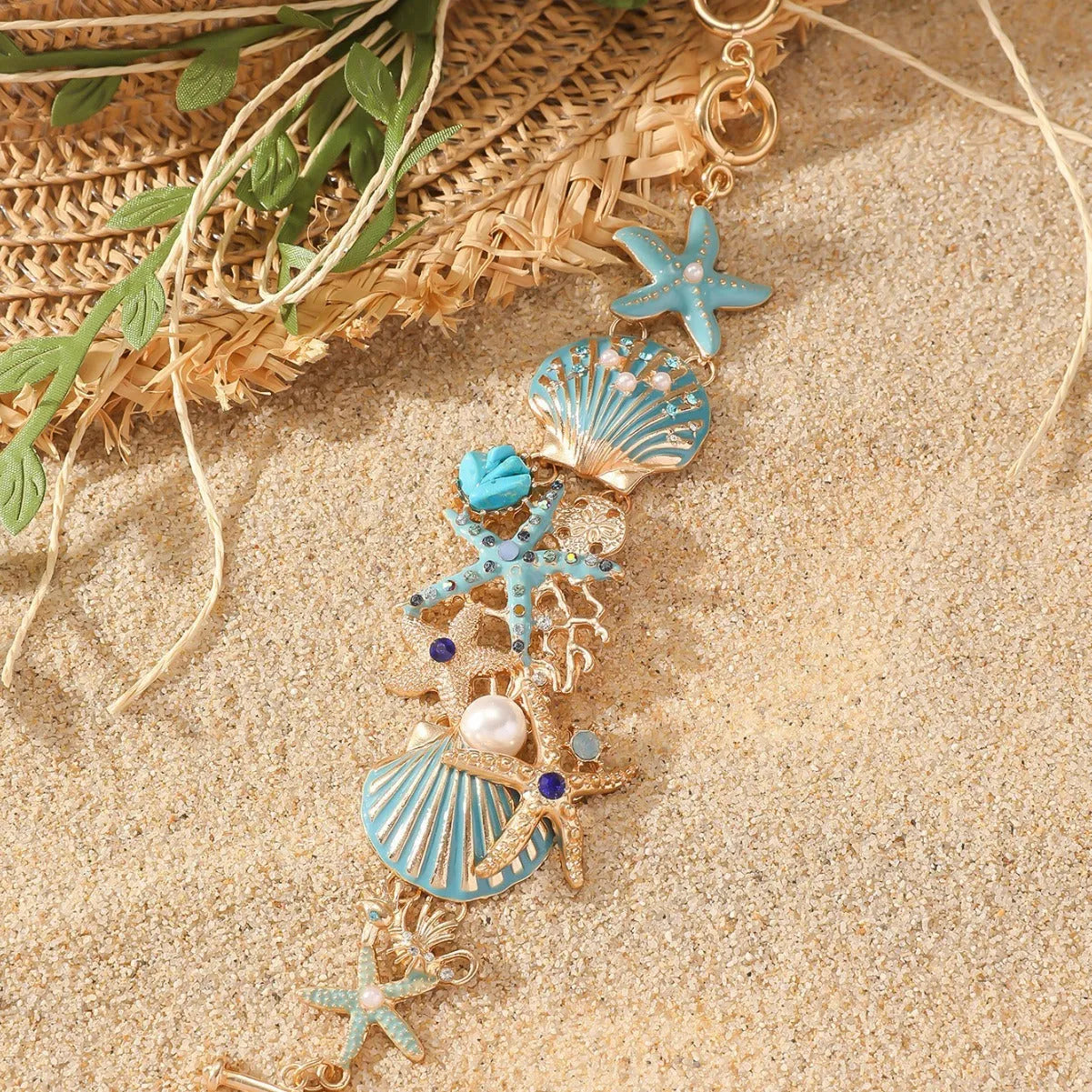 Women's alloy bracelet with starfish, star, and anchor design in turquoise, red, or blue colour.