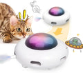 White UFO-shaped interactive cat toy with colourful feathers and LED lights for indoor feline enrichment