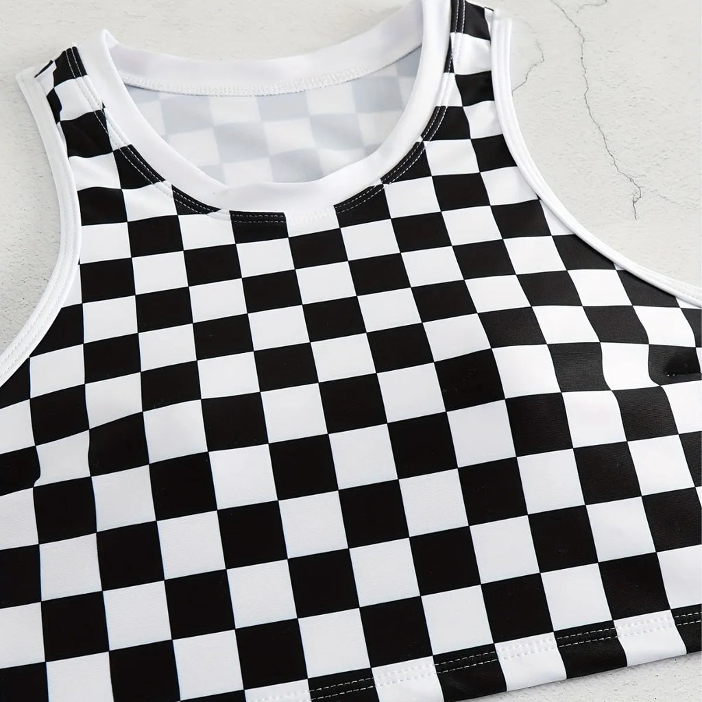 Women's backless one-piece swimsuit with black and white chessboard pattern and sporty suspender straps.