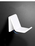 Universal plastic game controller bracket in black colour showing mounting points for installation