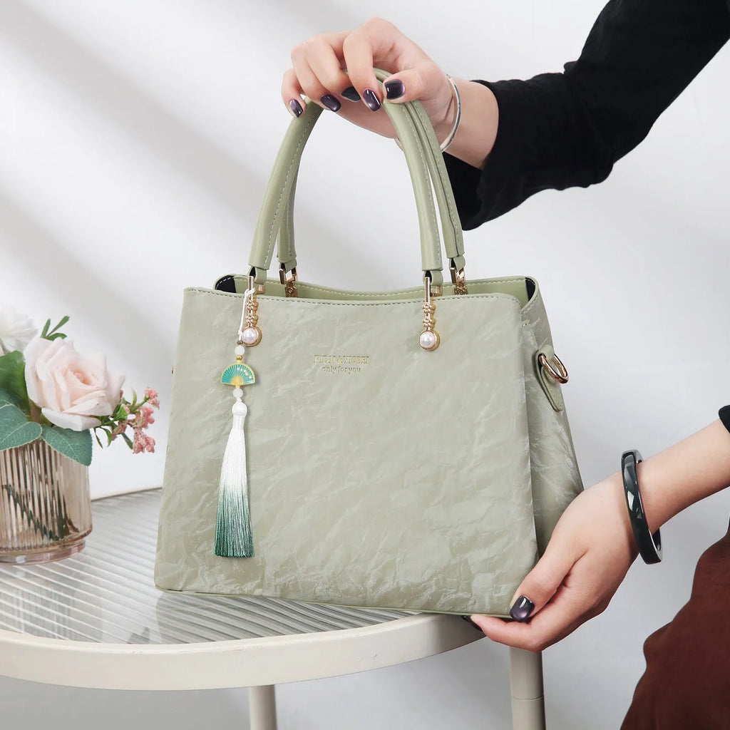 Women's PU shoulder bag in horizontal square shape with slit pocket, available in beige, black, green or red ethnic colours