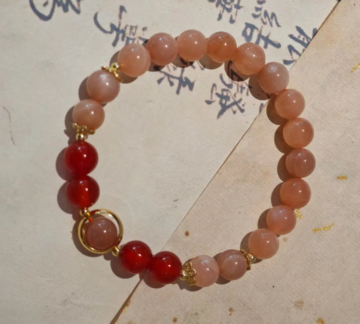 Handmade red agate and Sands Orange Sunstone ethnic bracelet for women with 8mm beads and star design.