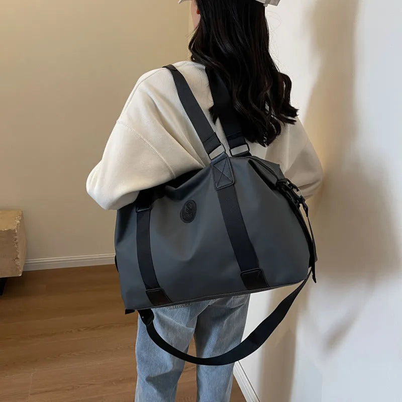 Large waterproof Oxford cloth travel bag with 36-55L capacity in solid colour options