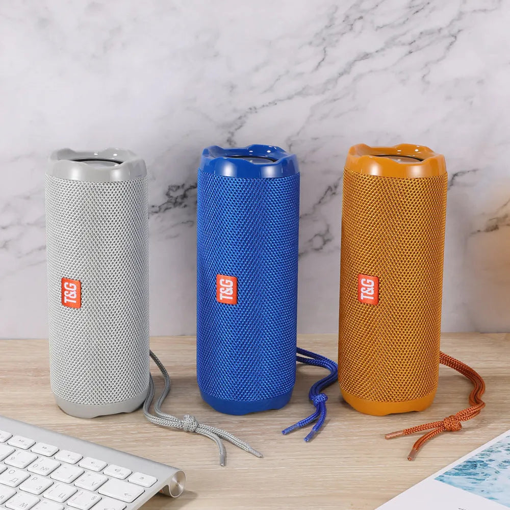 A rectangular portable Bluetooth speaker in multiple colours with a visible card slot on its side.