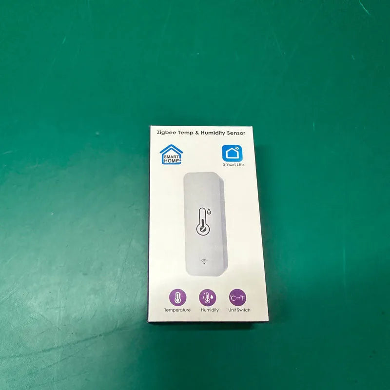 Compact white WiFi and Zigbee temperature and humidity sensor for smart home monitoring
