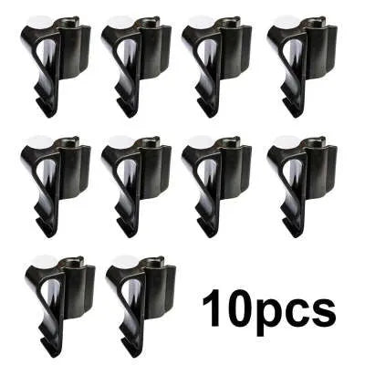 Black ABS plastic golf club clamp holding a golf club shaft