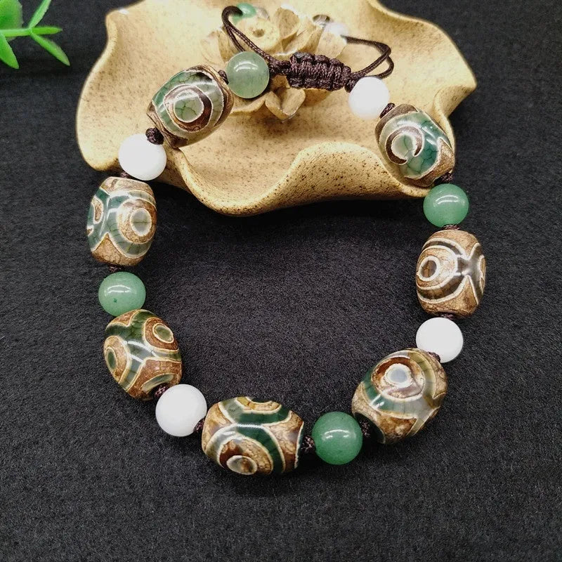 Green agate Tibetan bracelet with hand-woven three-eye geometric pattern