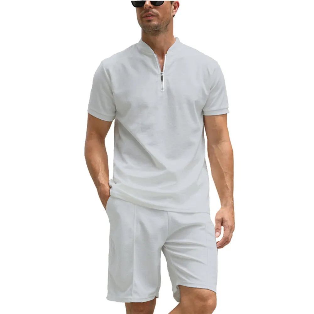 Men's solid colour polo shirt and trouser two-piece suit set in beaded bird's eye polyester fabric.