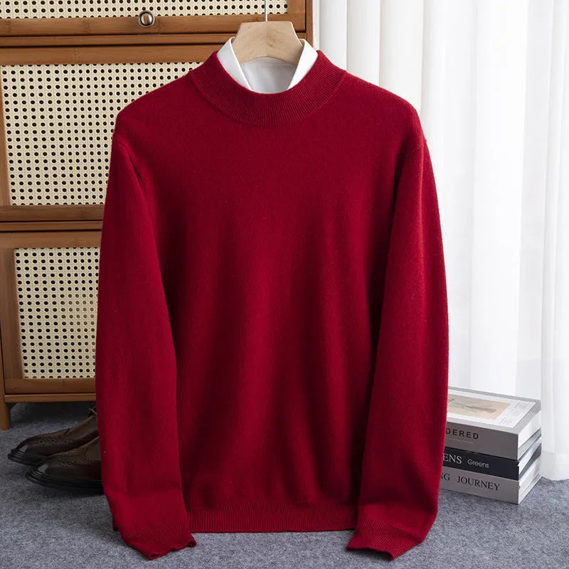 A man wearing a half-collar loose-fit wool sweater in a light business style, shown in a neutral colour.