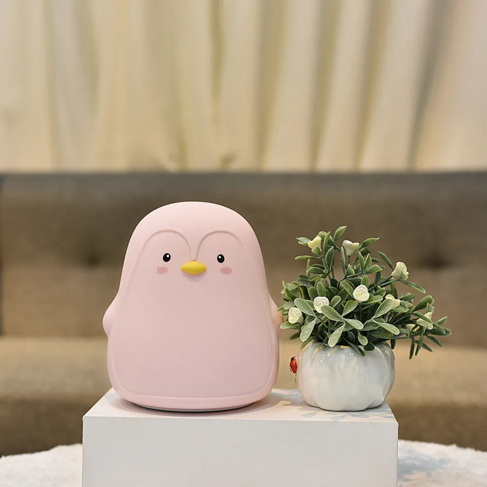 Penguin-shaped USB rechargeable night light with white LED illumination, measuring 118x110x132mm