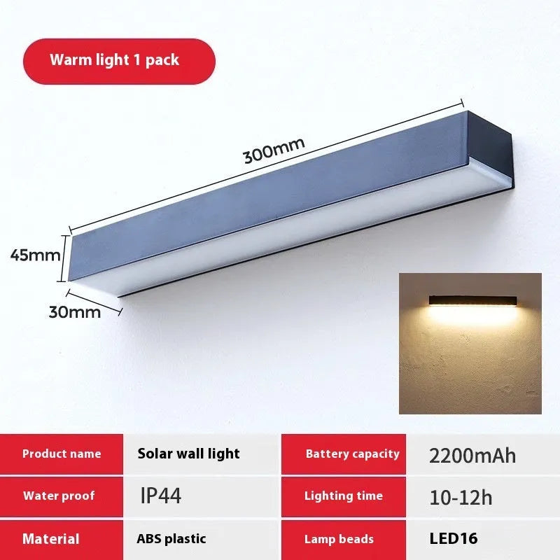 Black solar-powered outdoor wall lamp with strip design for garden and yard lighting