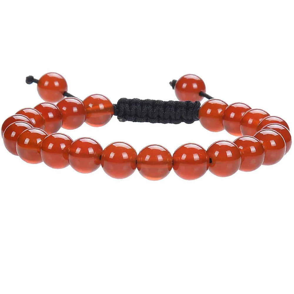 Women's flat knot braided healing bracelet with hand-woven aquamarine beads and geometric patterns