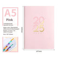 A5 faux leather daily planner schedule book open showing Dorian paper pages with 2025 calendar
