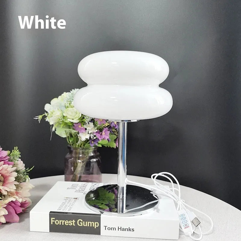 Desktop small table lamp with glass lampshade and USB plug-in tri-colour lighting on a wooden desk