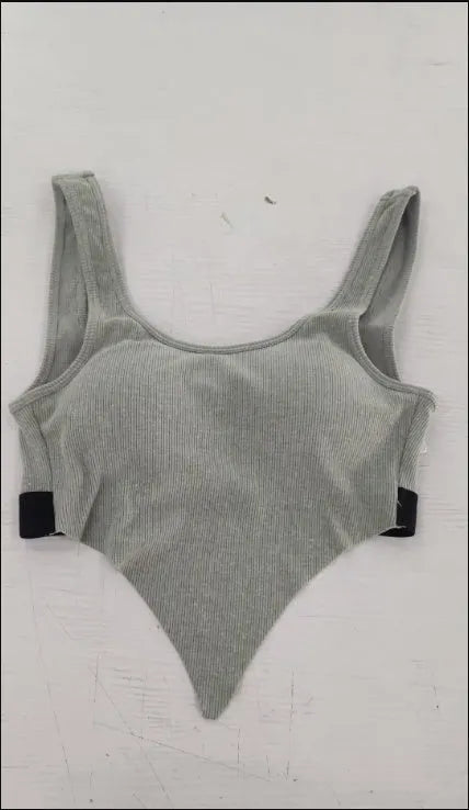 Solid colour polyester fibre sports bra in Black, Grey, Pink, or White for gym and yoga support
