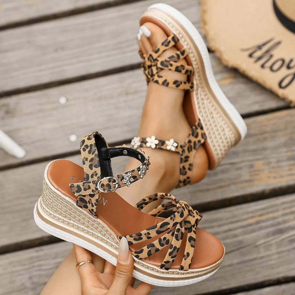 Light brown suede women's sandals with an ankle buckle and platform sole.