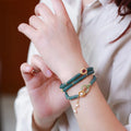 Blue water jade abacus bead and tourmaline ring bracelet with pearls under 4mm.