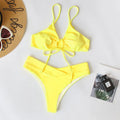 Women's solid colour bikini with a tied bow detail on the split front, shown in multiple colour options.