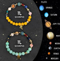 Two natural stone bead bracelets with engraved zodiac charms on a stretch elastic cord.