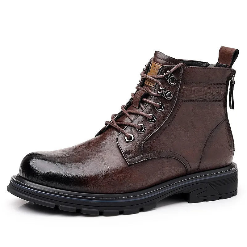 Black and brown leather Martin ankle boots with a rubber sole and visible stitching.