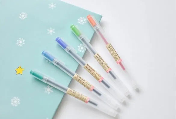 Muji 12-piece gel pen set with 0.5mm tips, showing transparent barrels with coloured ink and caps.