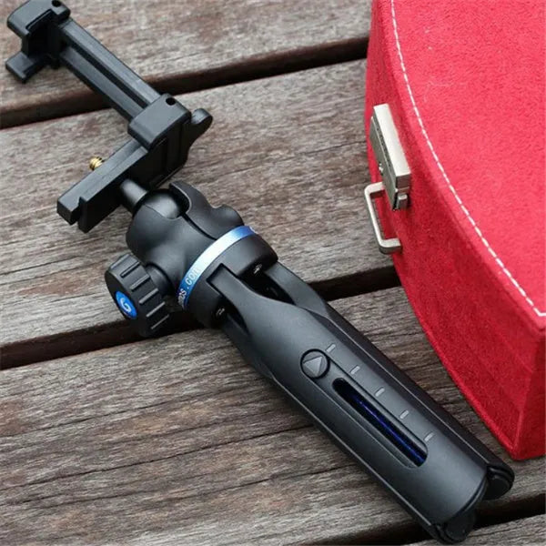 Black desktop mobile phone tripod for Apple iPhone and Huawei P30 models.