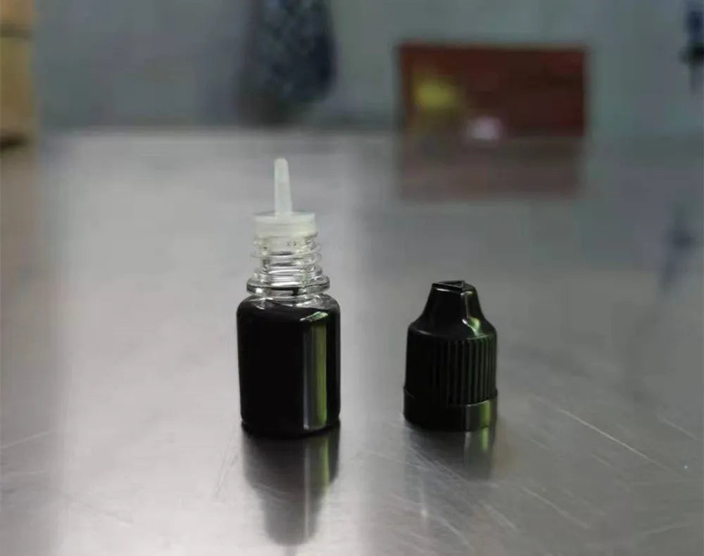 A 5ml bottle of black quick-dry confidentiality seal ink for office stamp seals.