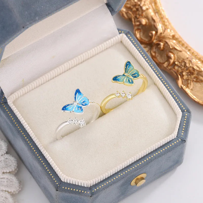 Copper butterfly ring with blue epoxy inlay, adjustable opening, silver colour, simple animal style
