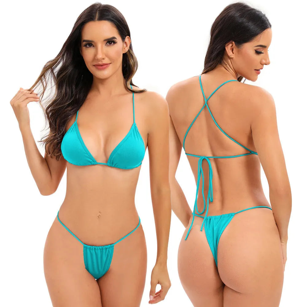 Women's candy coloured cross strap bikini swimsuit on a hanger, showing striped pattern and optional chest pad.