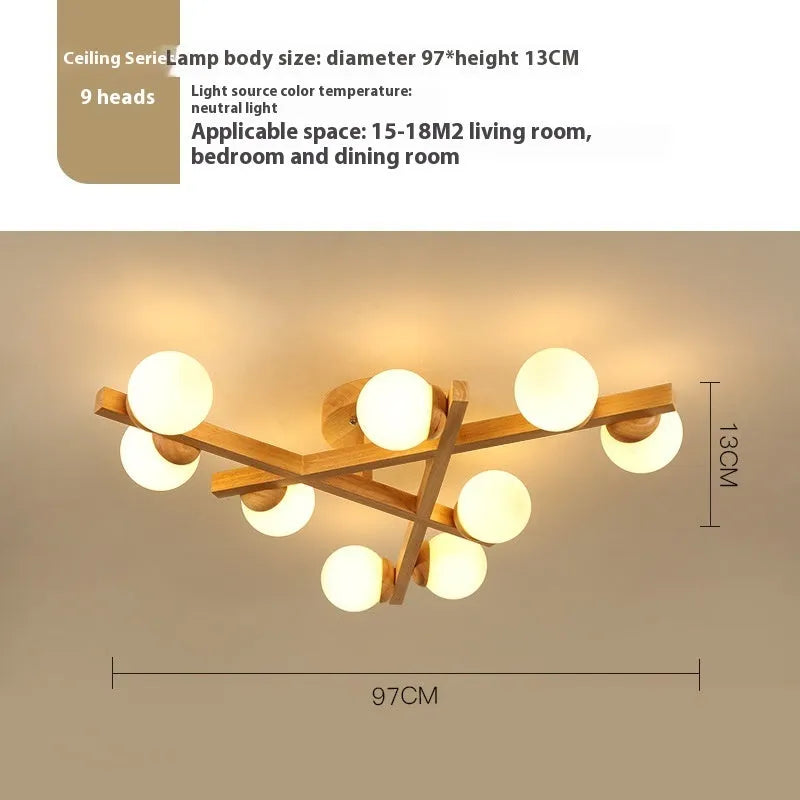 Modern Nordic-style ceiling light with wooden accents and three white lamp heads mounted on a clean, white ceiling.