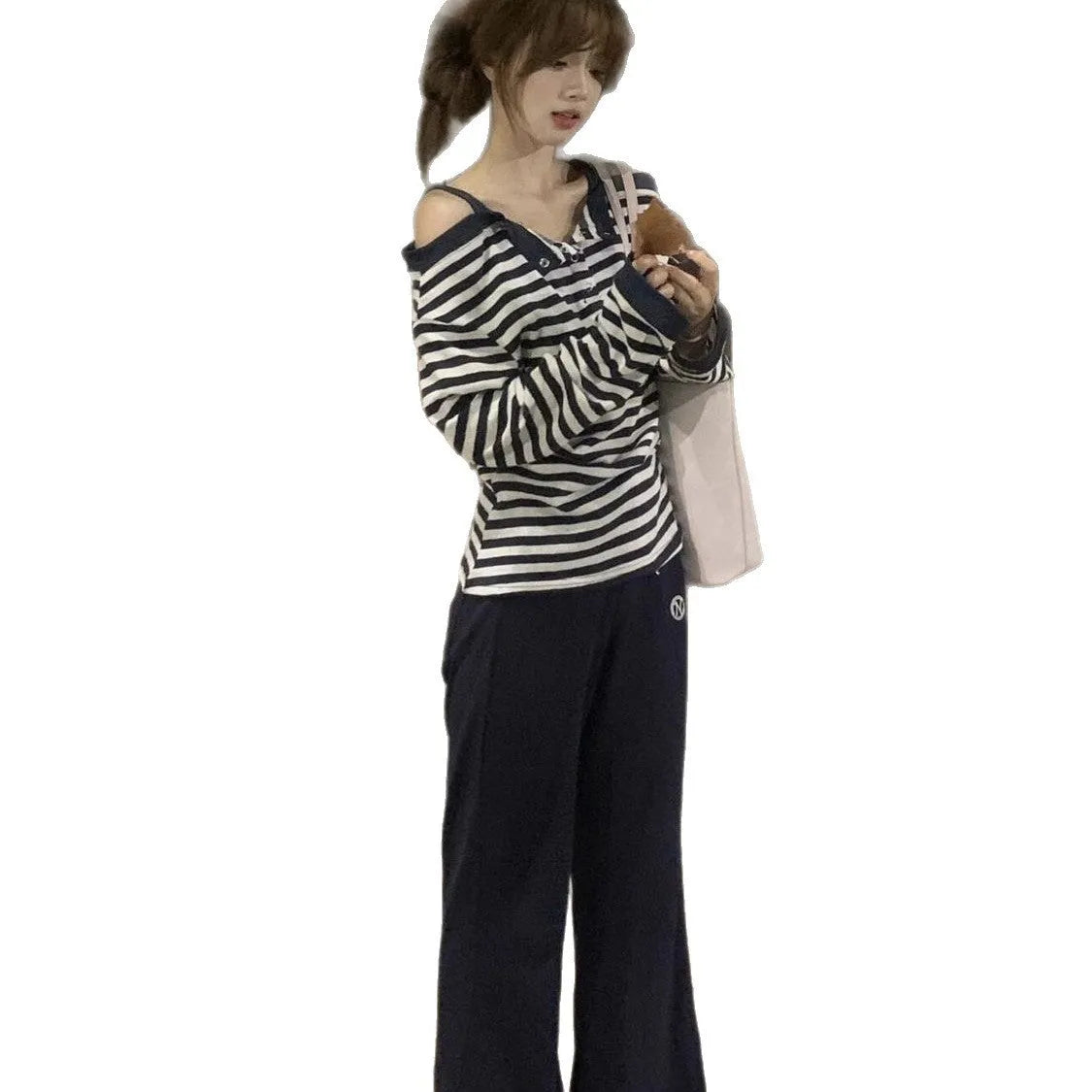 Dark blue Korean-style oversized women's long-sleeved T-shirt with embroidery and stripe details.