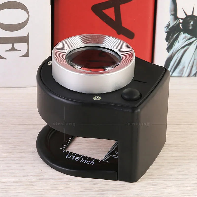 30x full metal magnifier with 6LED money detector light and scale lens, front view, in black finish