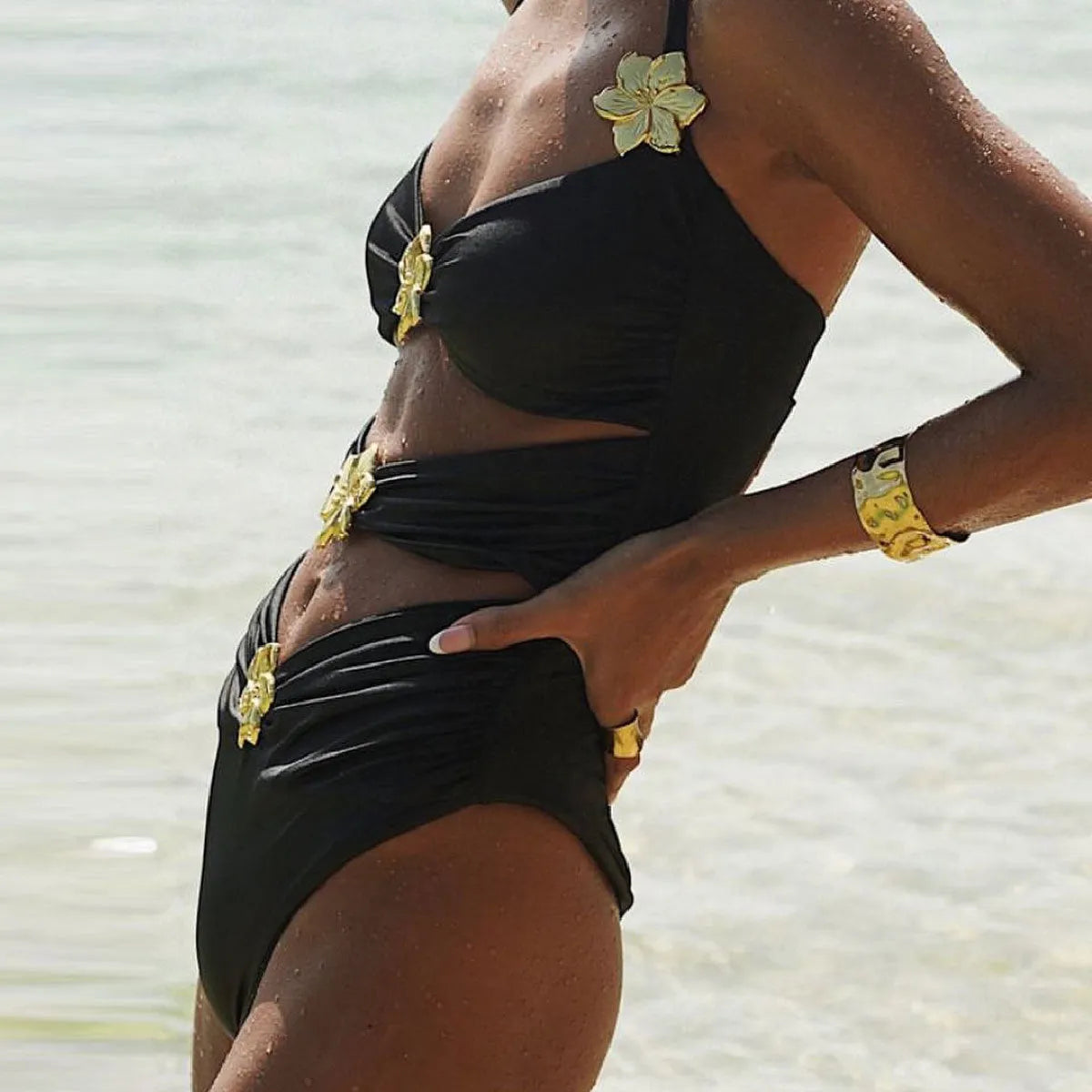 Women's solid colour one-piece swimsuit with high waist and matching short skirt.