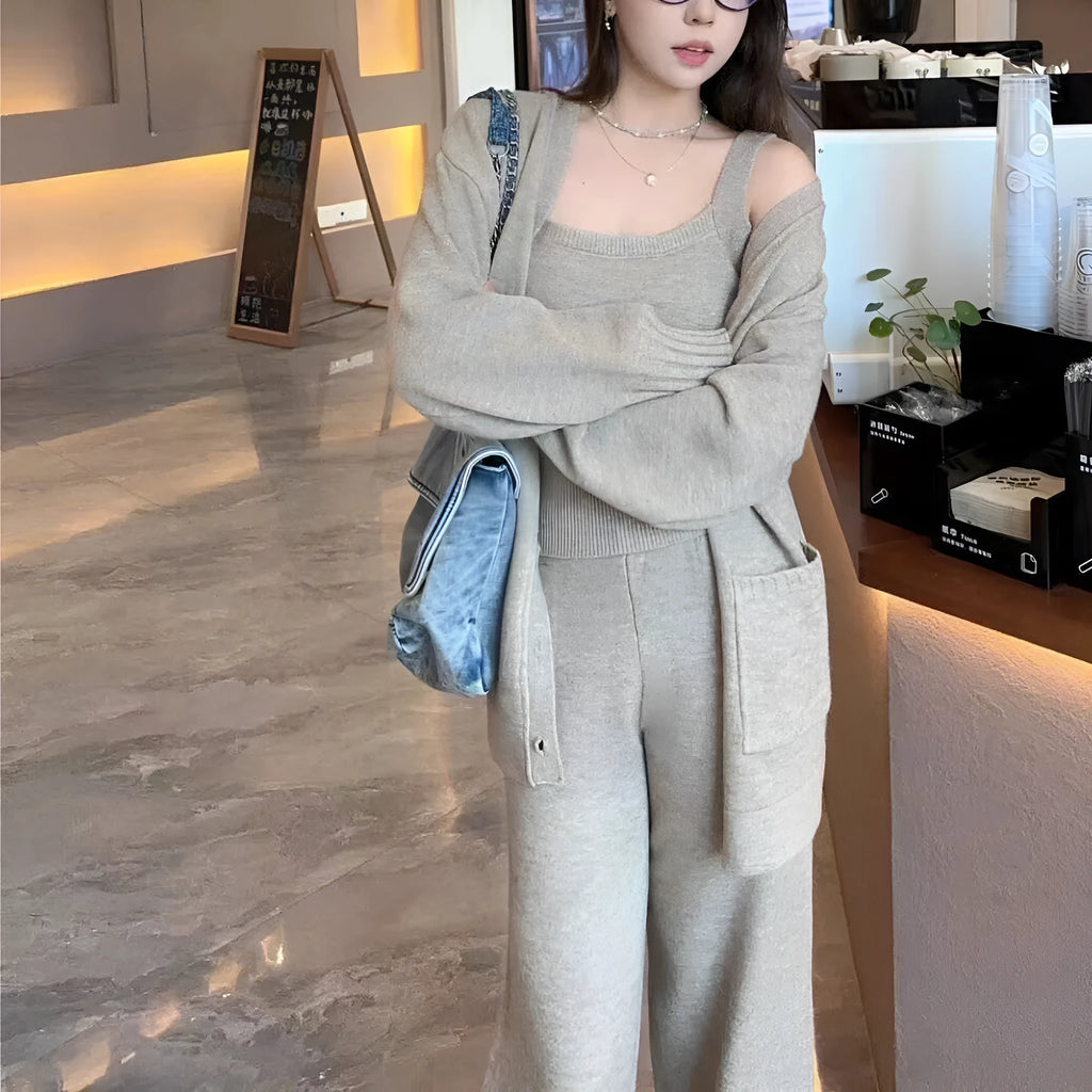 Women's light brown knit cardigan, vest, and loose trousers three-piece set laid flat.