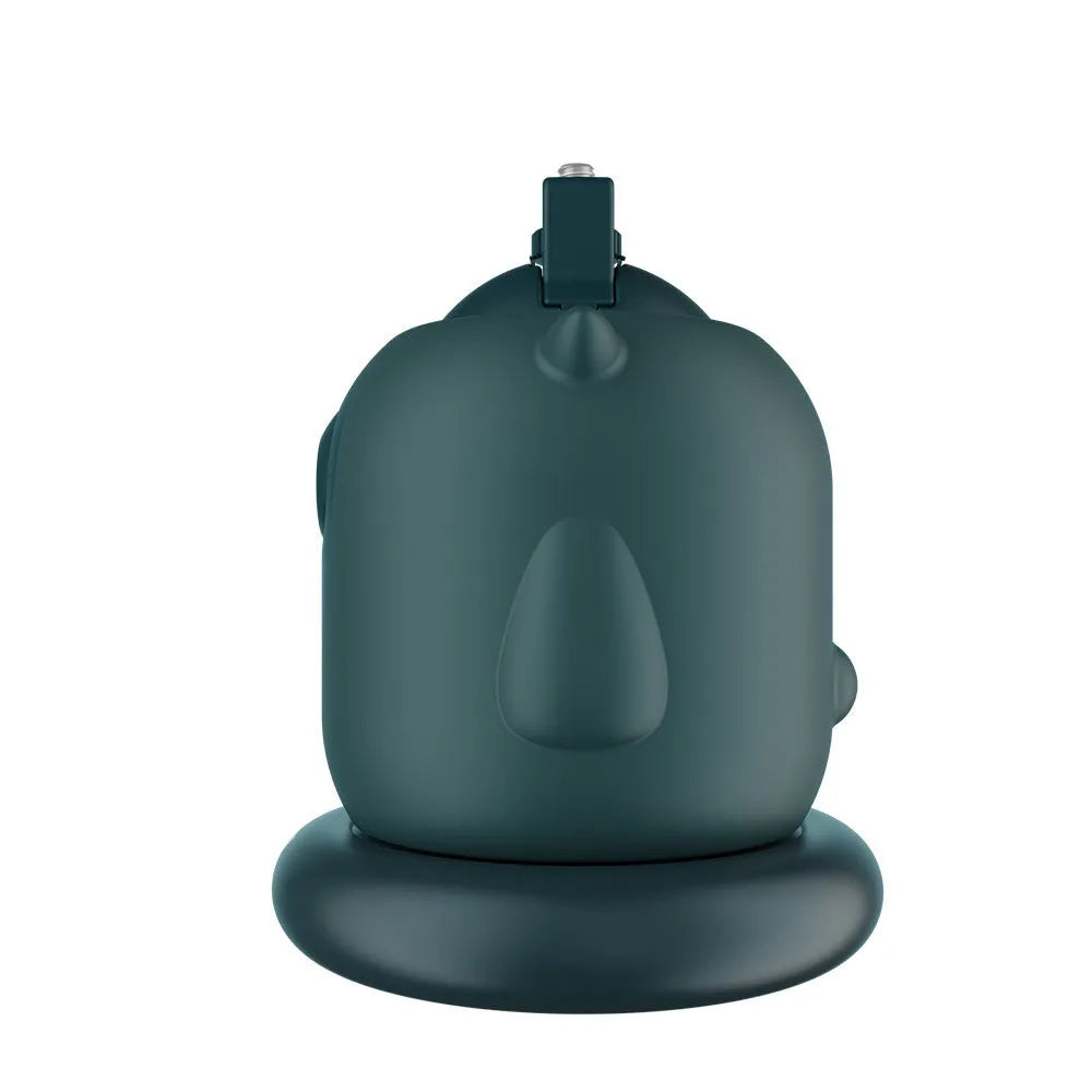 Dark green intelligent AI face tracking gimbal with 360-degree rotation on a desk.