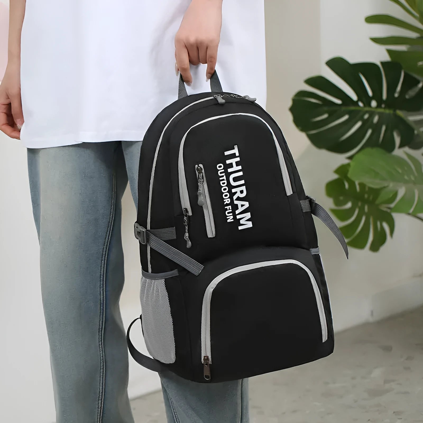 Outdoor folding travel backpack in multiple colours showing adjustable straps and 20-35L capacity.