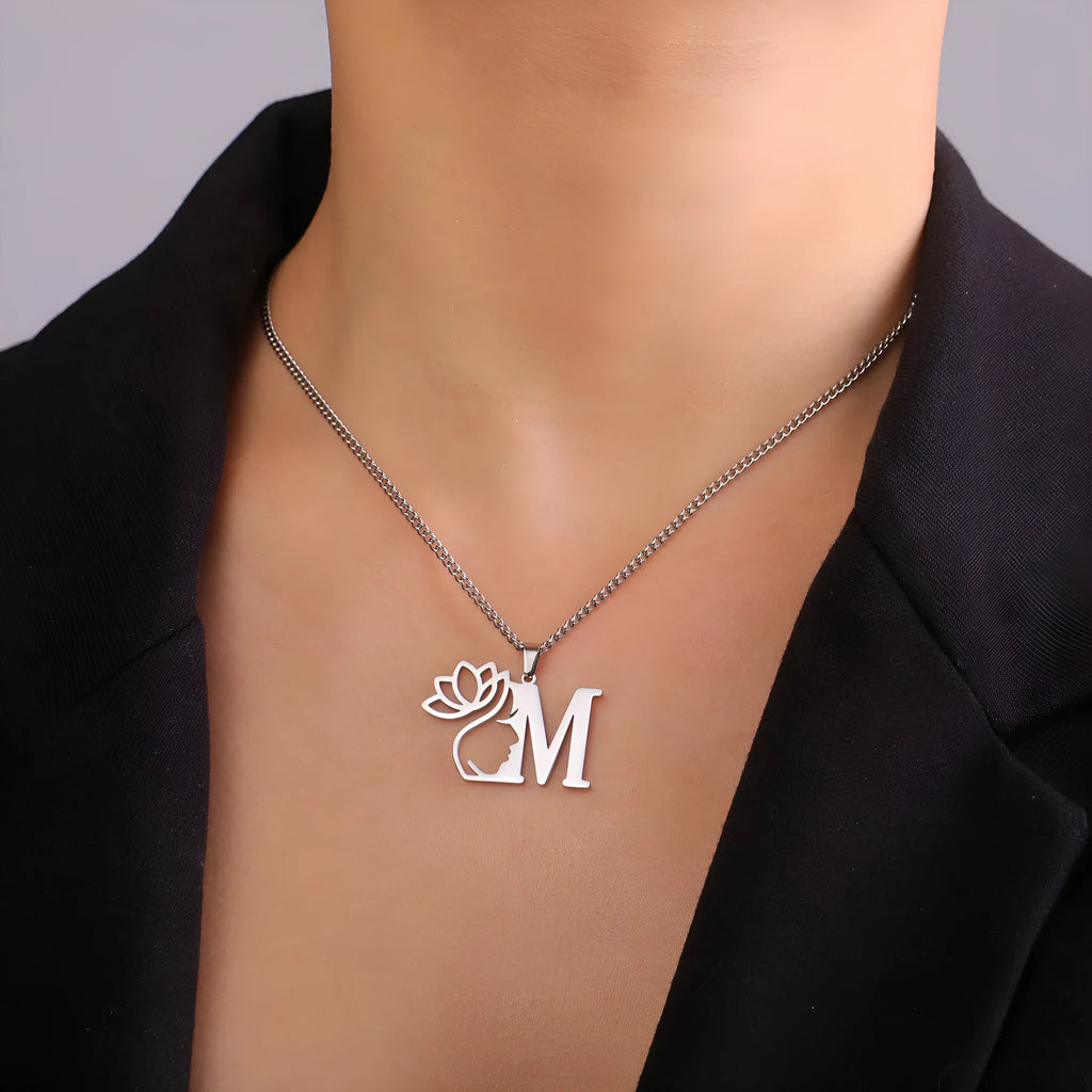 Stainless steel cross chain necklace with a single gold or silver coloured letter pendant.